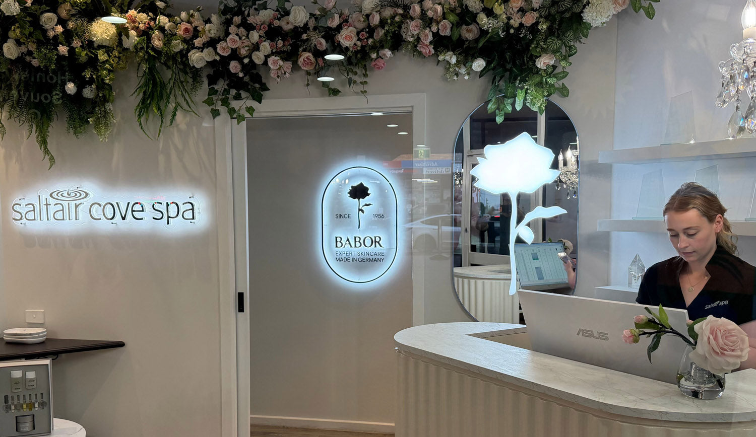 Backlit spa signage in a reception interior